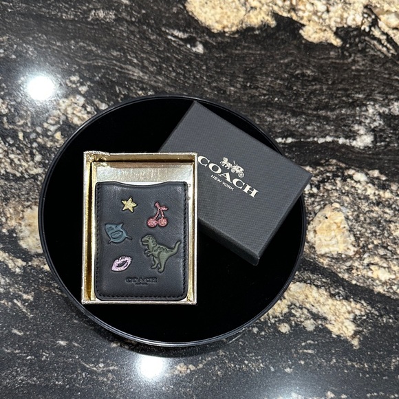 Coach Accessories - COACH Boxed Phone Pocket
Sticker (Style No: 23727B)